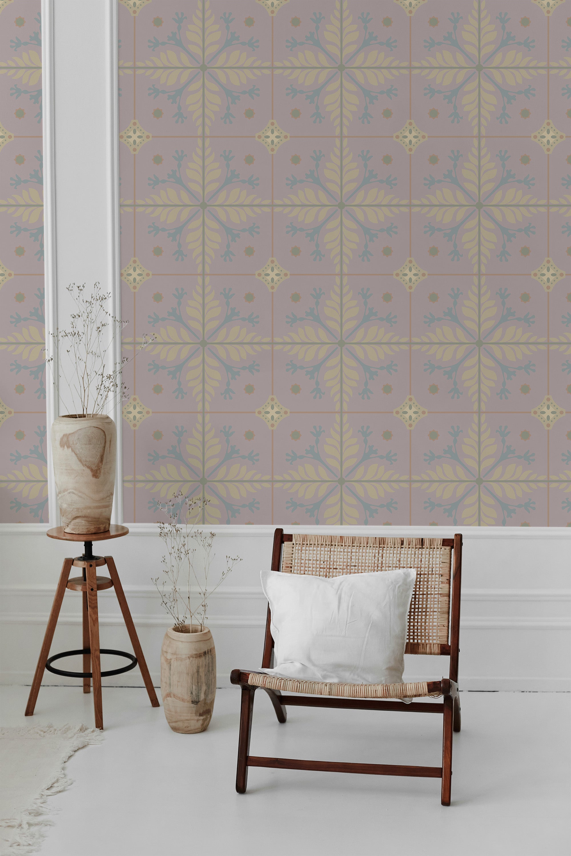 A pink floral wallpaper with a tile pattern composed of yellow leafy motifs and blue floral accents, giving the room a vintage, traditional wallpaper.