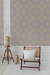 A pink floral wallpaper with a tile pattern composed of yellow leafy motifs and blue floral accents, giving the room a vintage, traditional wallpaper.