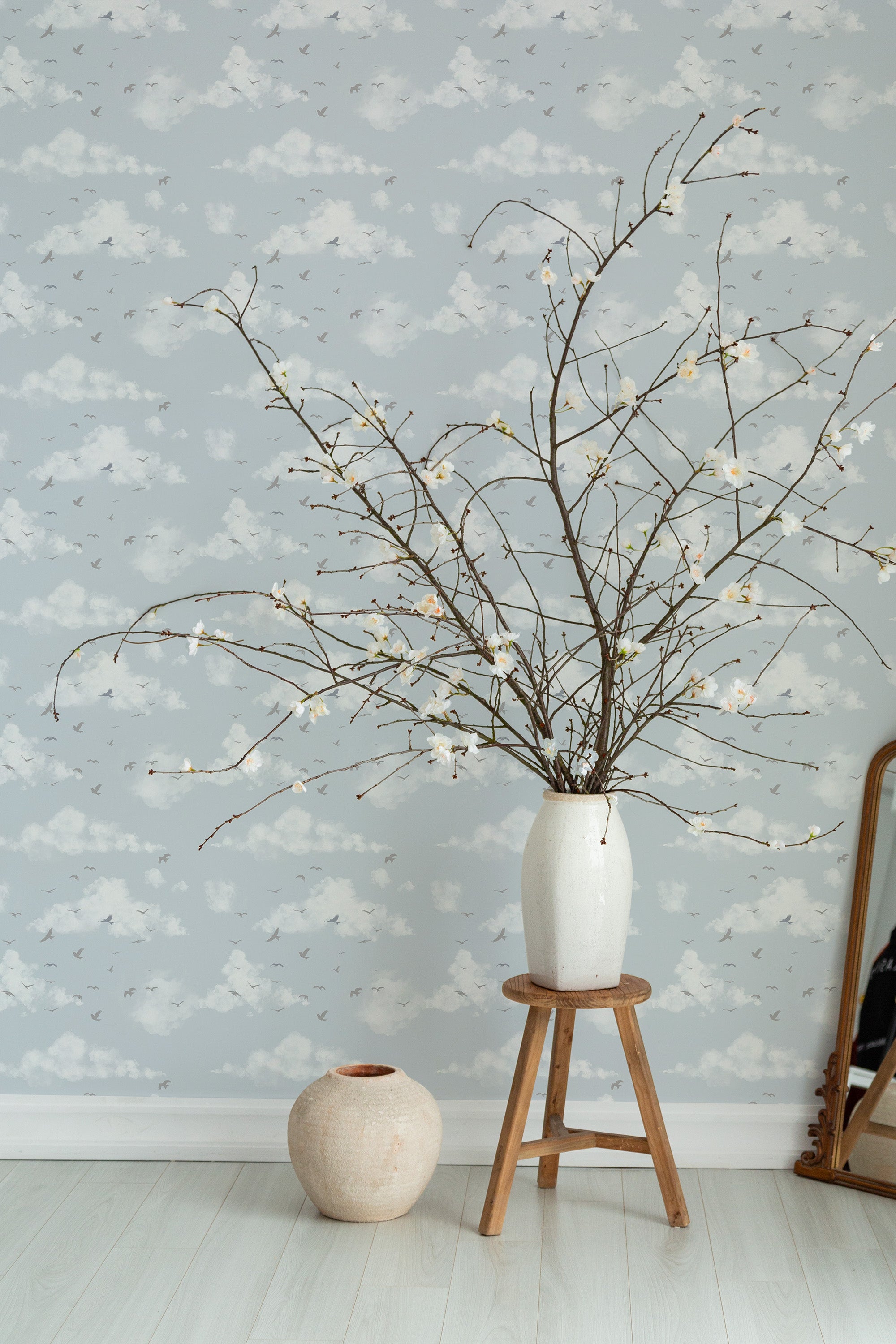 Self-adhesive wallpaper with a Bird Bay design, featuring a soft, muted background with white clouds and small birds in flight, creating a serene, nature-inspired atmosphere.