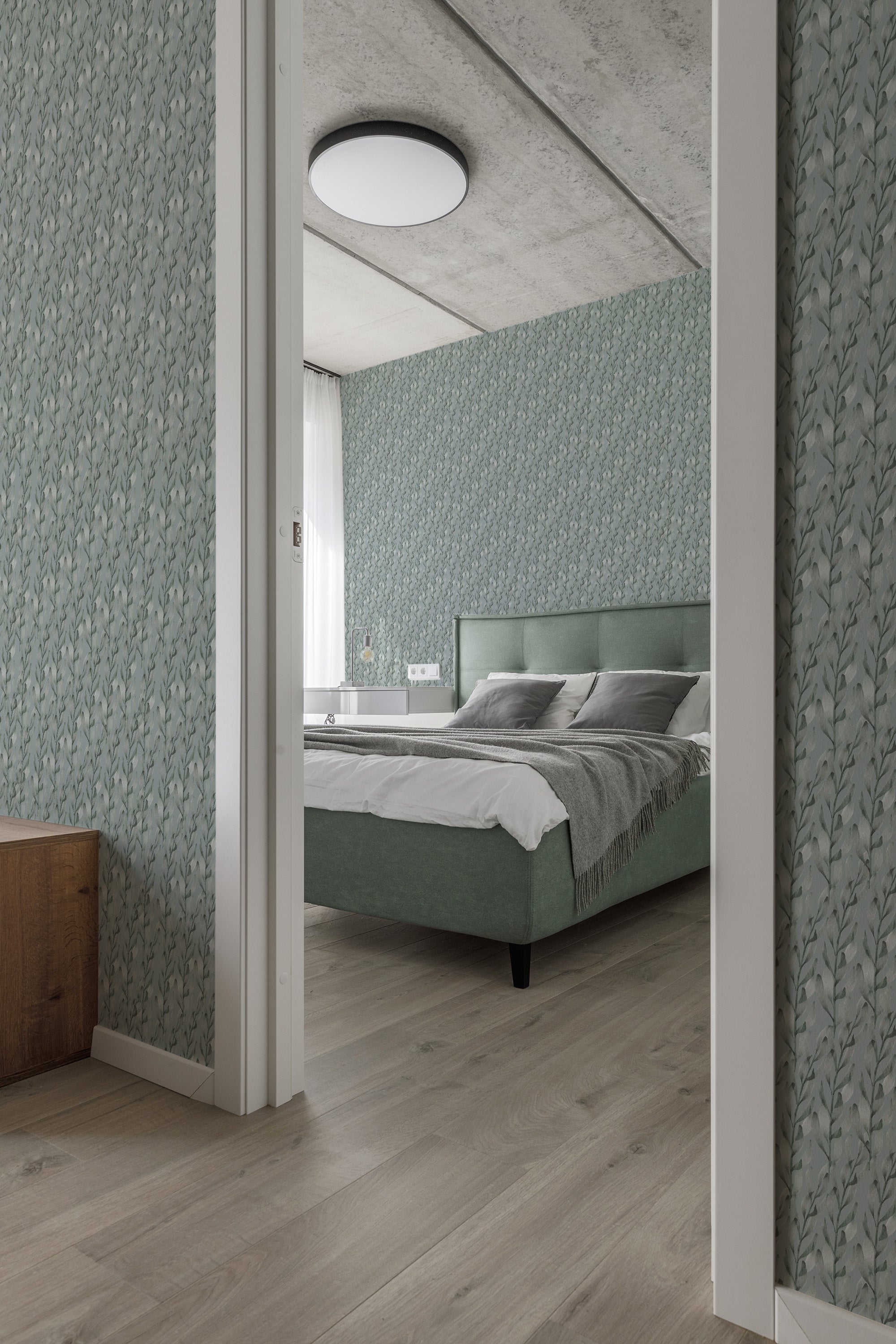Wallpaper with a subtle pattern of watercolor leaves in soft, muted green tones, creating a calm and serene atmosphere in a bedroom. Traditional wallpaper.