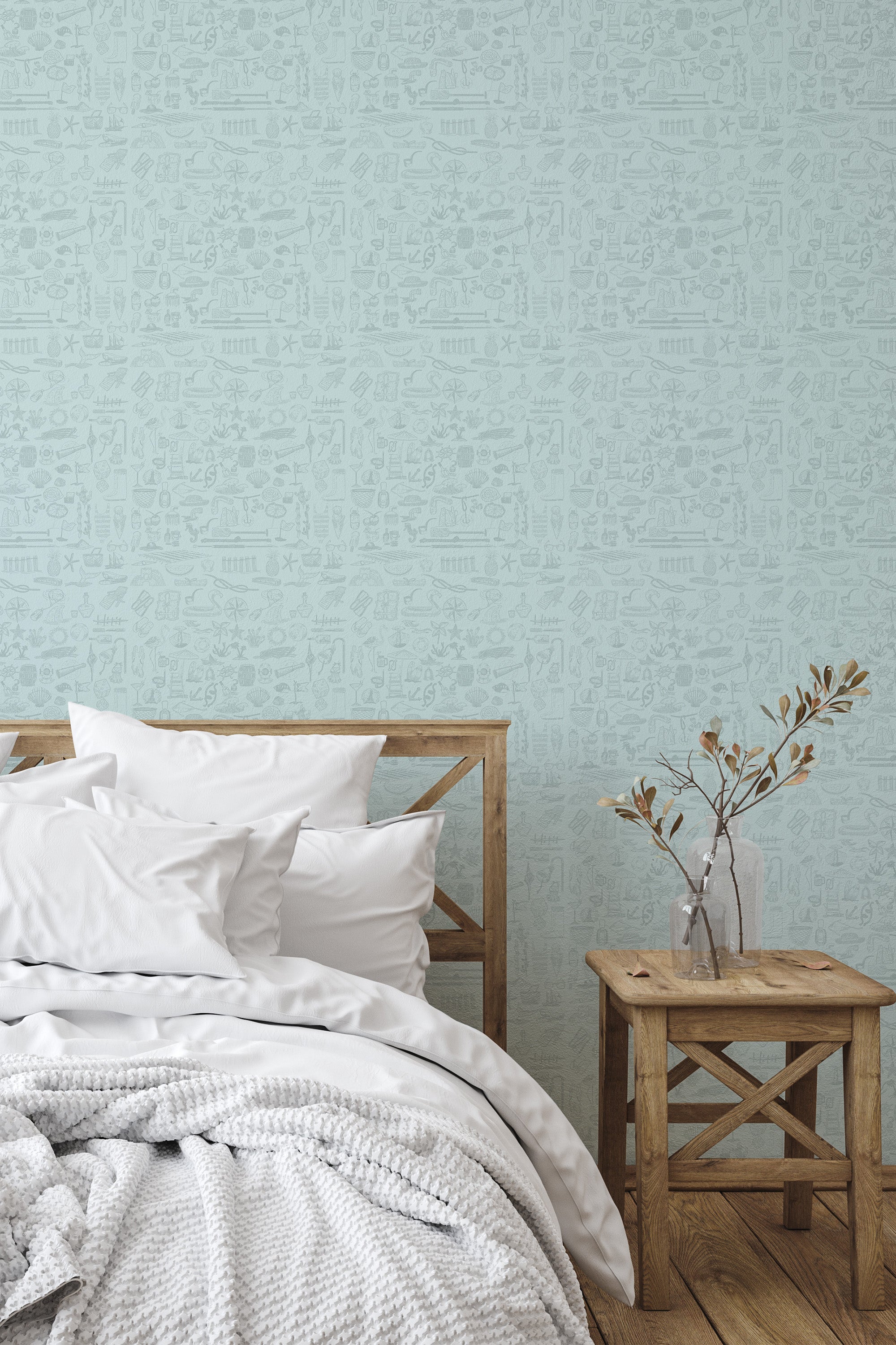Self-adhesive wallpaper with a Coastal elements design in soft, muted shades, filled with intricate seaside motifs such as shells, starfish, and anchors on a light blue background.