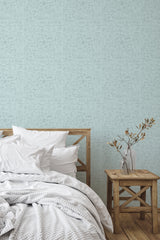 Self-adhesive wallpaper with a Coastal elements design in soft, muted shades, filled with intricate seaside motifs such as shells, starfish, and anchors on a light blue background.