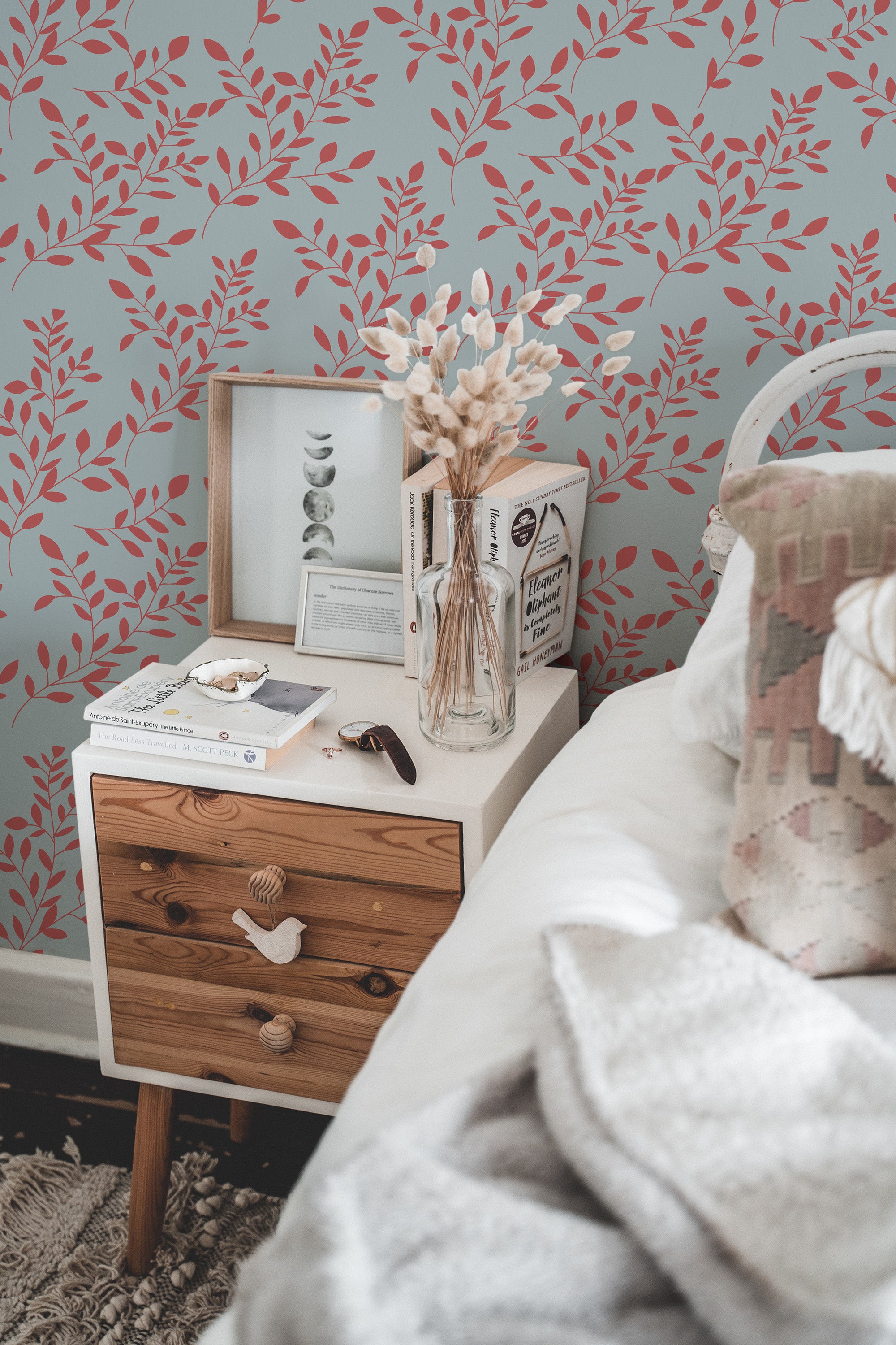 Self-adhesive wallpaper with a red branch design set against a soft light blue background, adding a natural and elegant touch to the room.