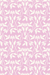 Floral pattern with white leaves and delicate flowers intertwined with curving vines, set against a soft pink background. Peel and stick removable wallpaper.