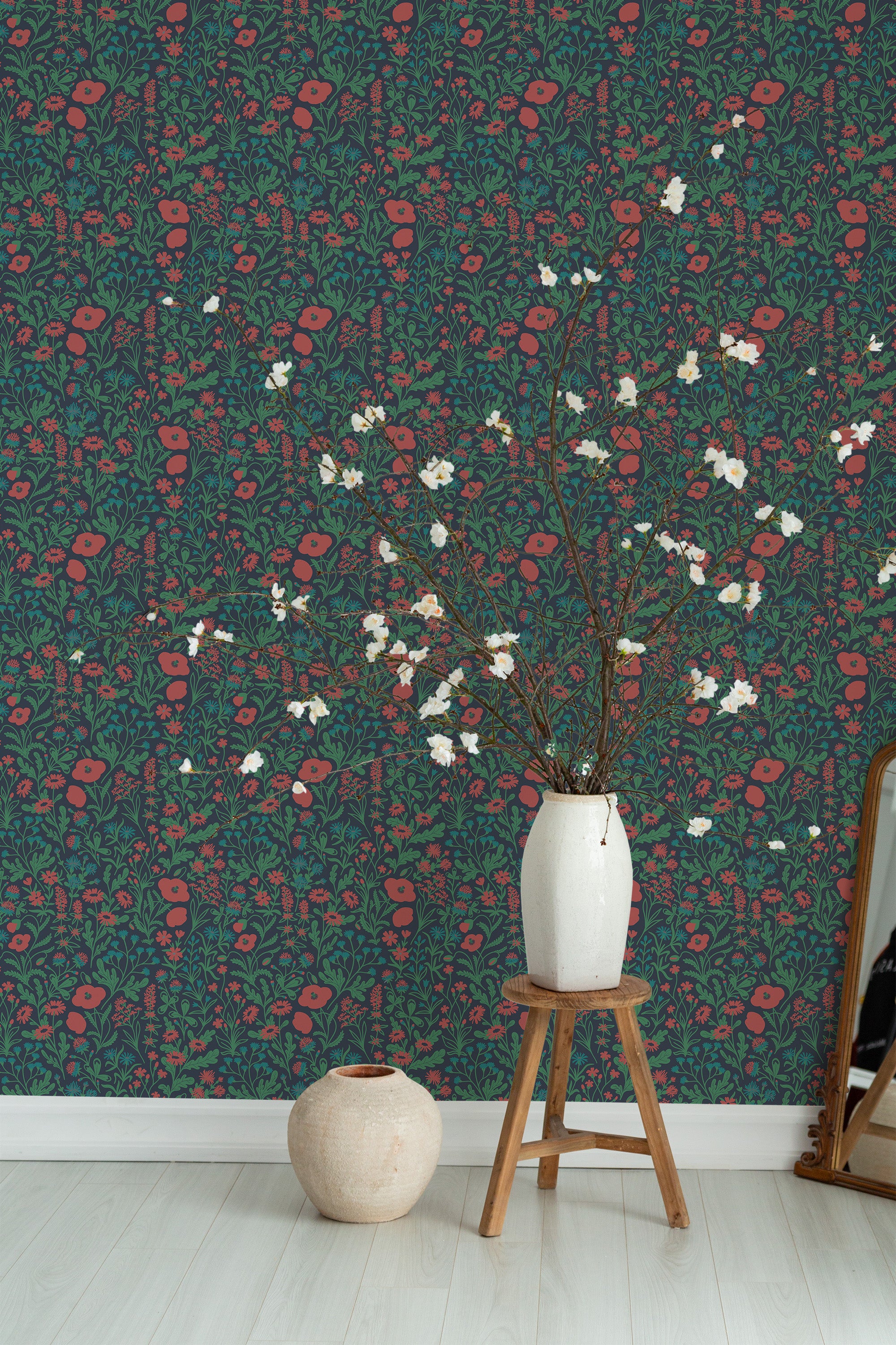Self-adhesive wallpaper with a whimsical meadow design, using deep green as a backdrop filled with vibrant red poppies, delicate blue and green foliage, and other floral elements.