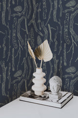 Self-adhesive wallpaper with a 'Branches' design, featuring detailed outlines of twigs, branches, and pinecones in light tones set against a dark background.