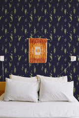 Self-adhesive wallpaper with a Bold Snowdrops design on a dark background, featuring delicate white snowdrop flowers and green leaves.