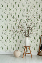 Self-adhesive wallpaper in minimal snow lilies design with delicate green botanical patterns spread evenly across a pale, light-colored background.
