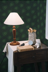 Self-adhesive dark green wallpaper with a repeating pattern of delicate fern leaves, adding a touch of nature and elegance to the room.