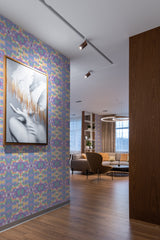 Colorful psychedelic wallpaper design with swirling patterns and organic shapes in shades of purple, blue, and yellow, creating a retro and vibrant visual effect while adorning the room using traditional wallpaper.