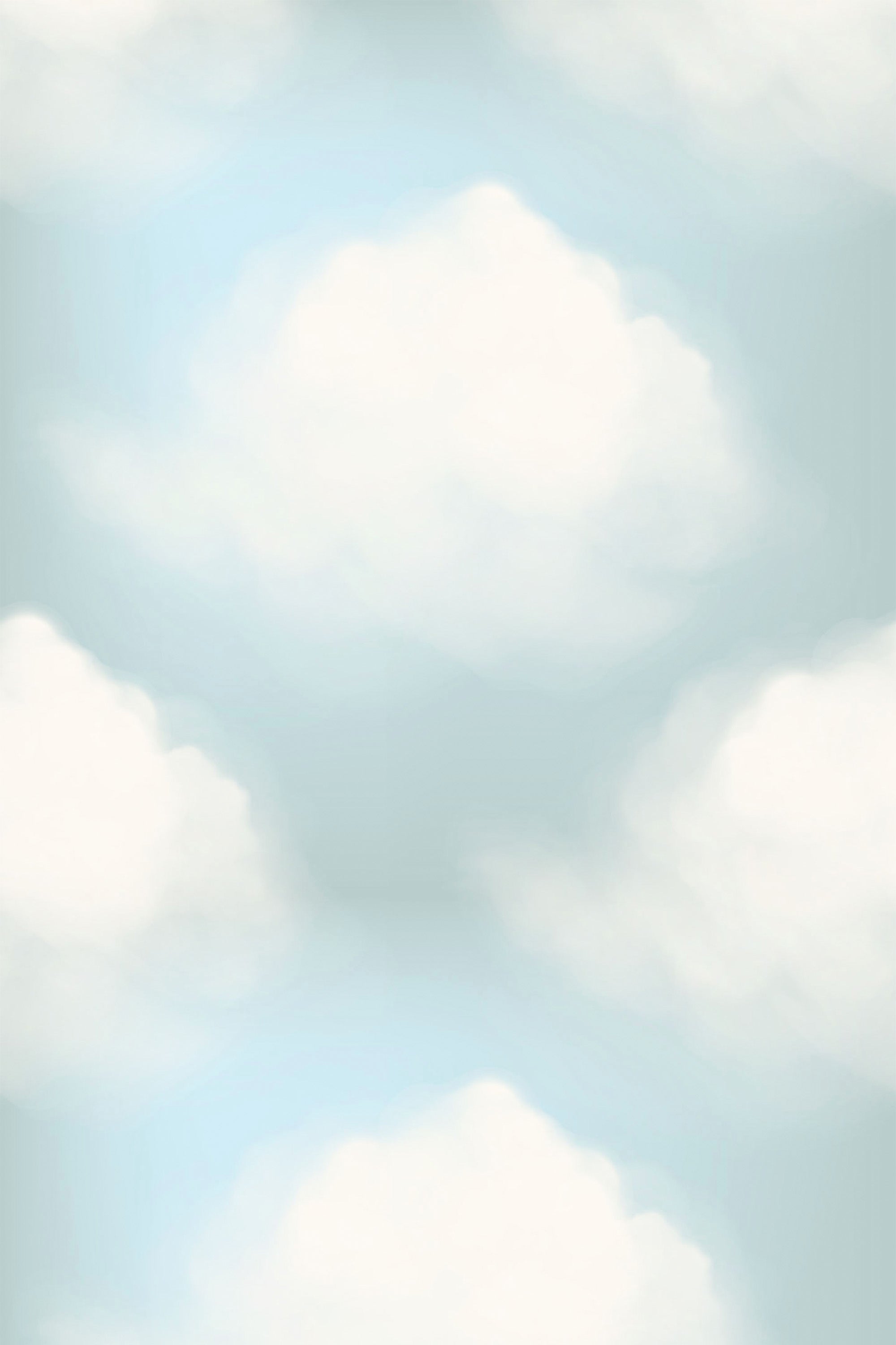 A soft, tranquil wallpaper with fluffy white clouds set against a pale blue sky, creating a serene atmosphere. Peel and stick removable wallpaper.