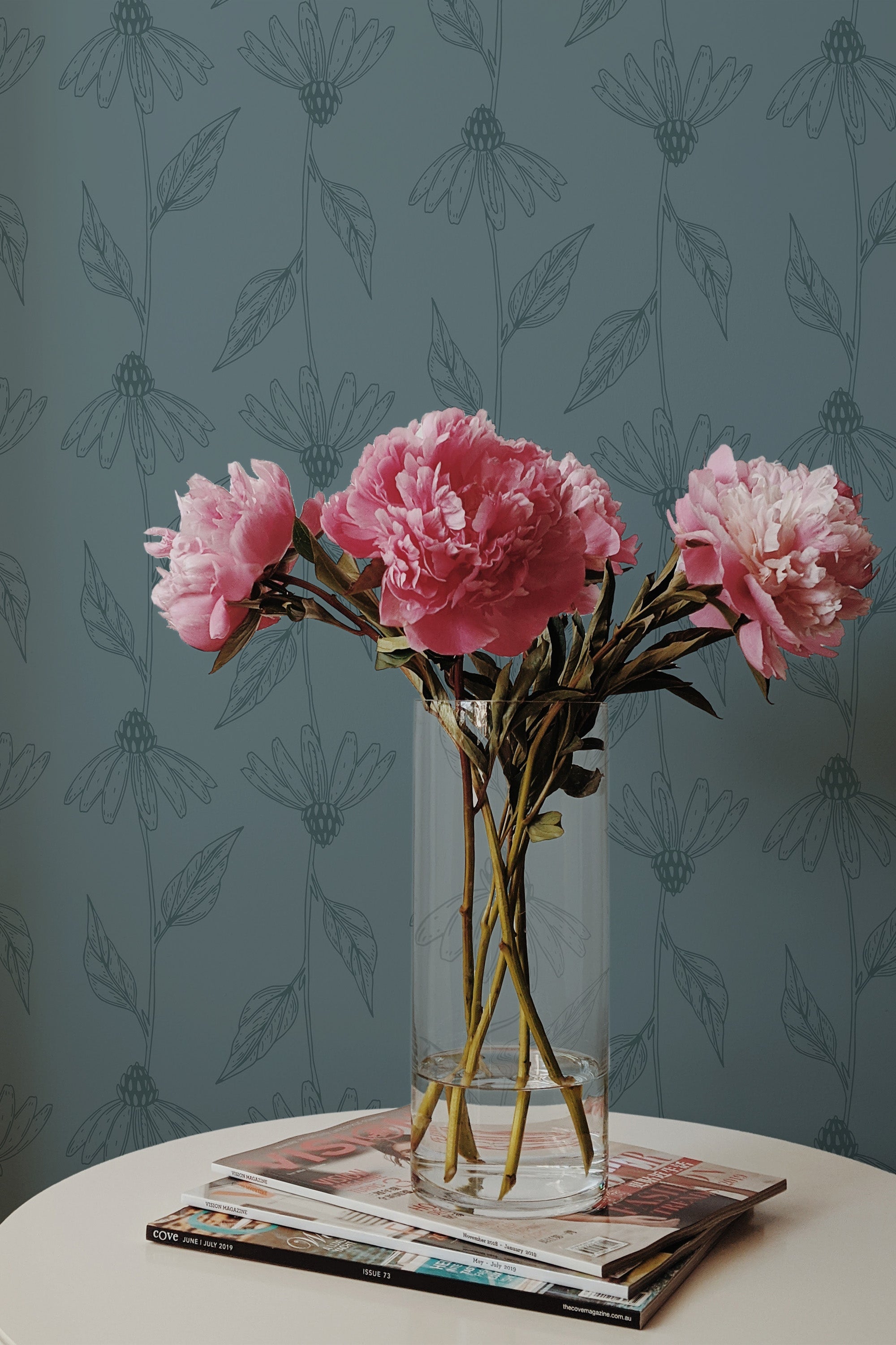 Self-adhesive wallpaper with a Daisy line art design, set against a muted green background, highlighting elegant, minimalist daisy illustrations in subtle tones.