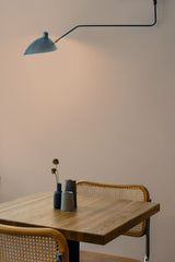 Self-adhesive wallpaper in a solid tan color, creating a warm and neutral backdrop that complements the minimalistic decor in the room.