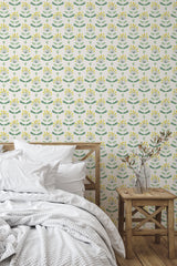 Self-adhesive wallpaper with a repeating abstract sunflower pattern in shades of yellow, with green leaves scattered against a light background.
