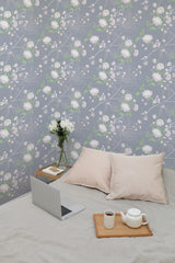 Self-adhesive wallpaper with a Peony tree design, featuring delicate white and pink peonies surrounded by green leaves on a light gray background, adding a soft and elegant touch to the room.