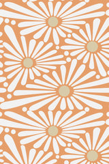 A vibrant pattern of large white sunflower shapes with radiating petals and muted yellow centers on a warm orange background. Peel and stick removable wallpaper.