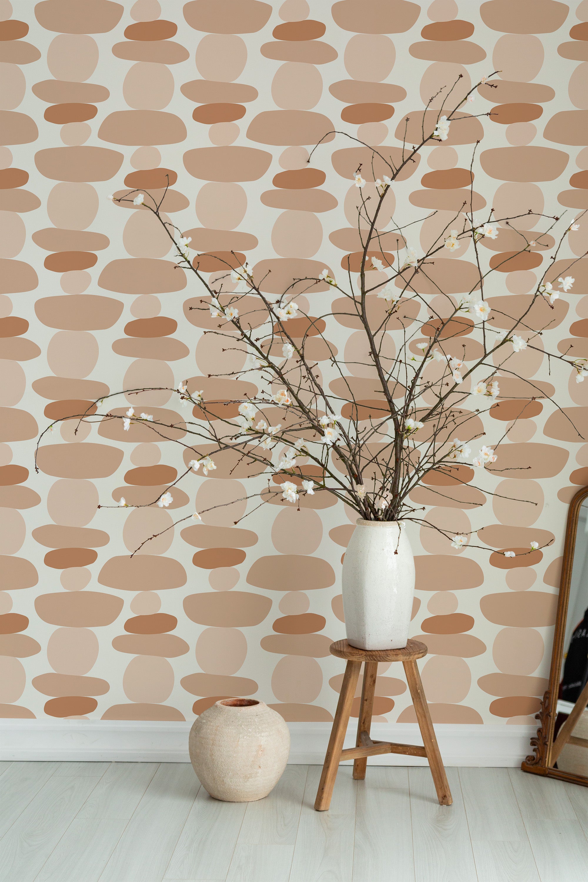 Self-adhesive boho dot stacks wallpaper with overlapping circles in shades of brown and beige on a neutral background, complementing a modern room decor style.