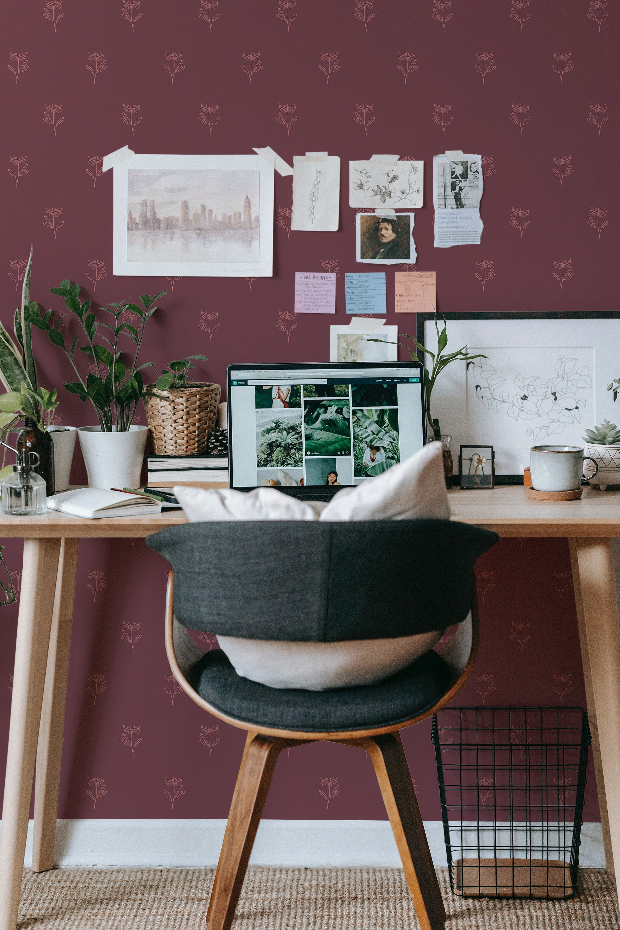 Self-adhesive wallpaper with a pattern of delicate autumn flowers against a rich maroon background, enhancing the cozy ambiance of a well-organized work space.