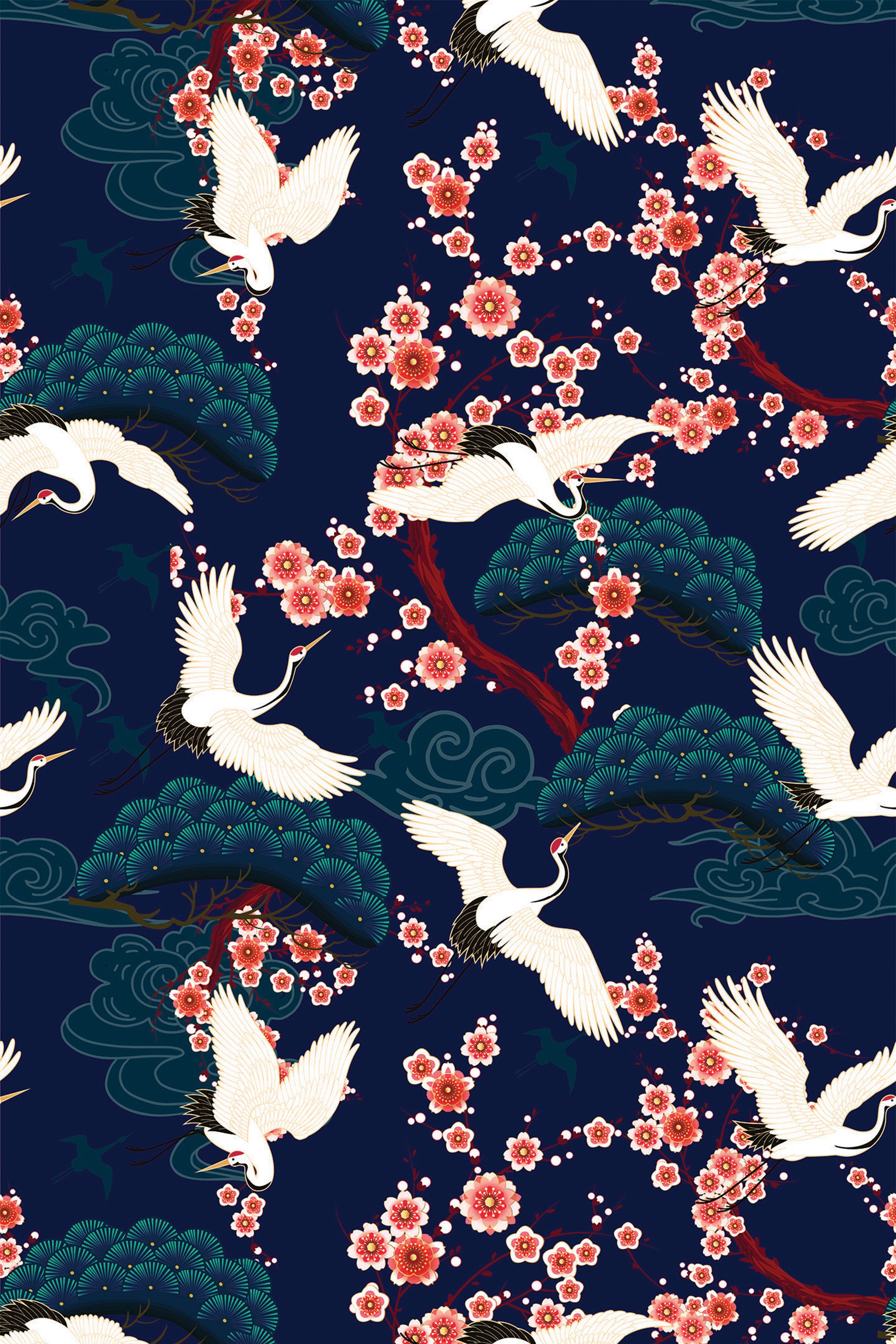 Elegant white cranes with outstretched wings in various postures, accented by pink cherry blossoms and green foliage, set against a deep blue background. Bold Cranes peel and stick removable wallpaper.