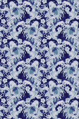 A pattern of stylized blue and white fish interlaced with aquatic plants on a navy background, peel and stick removable wallpaper.