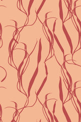 A pattern of elongated, abstract plant-like shapes in dark red on a peach background, forming a modern, botanical aesthetic for a peel and stick removable wallpaper.