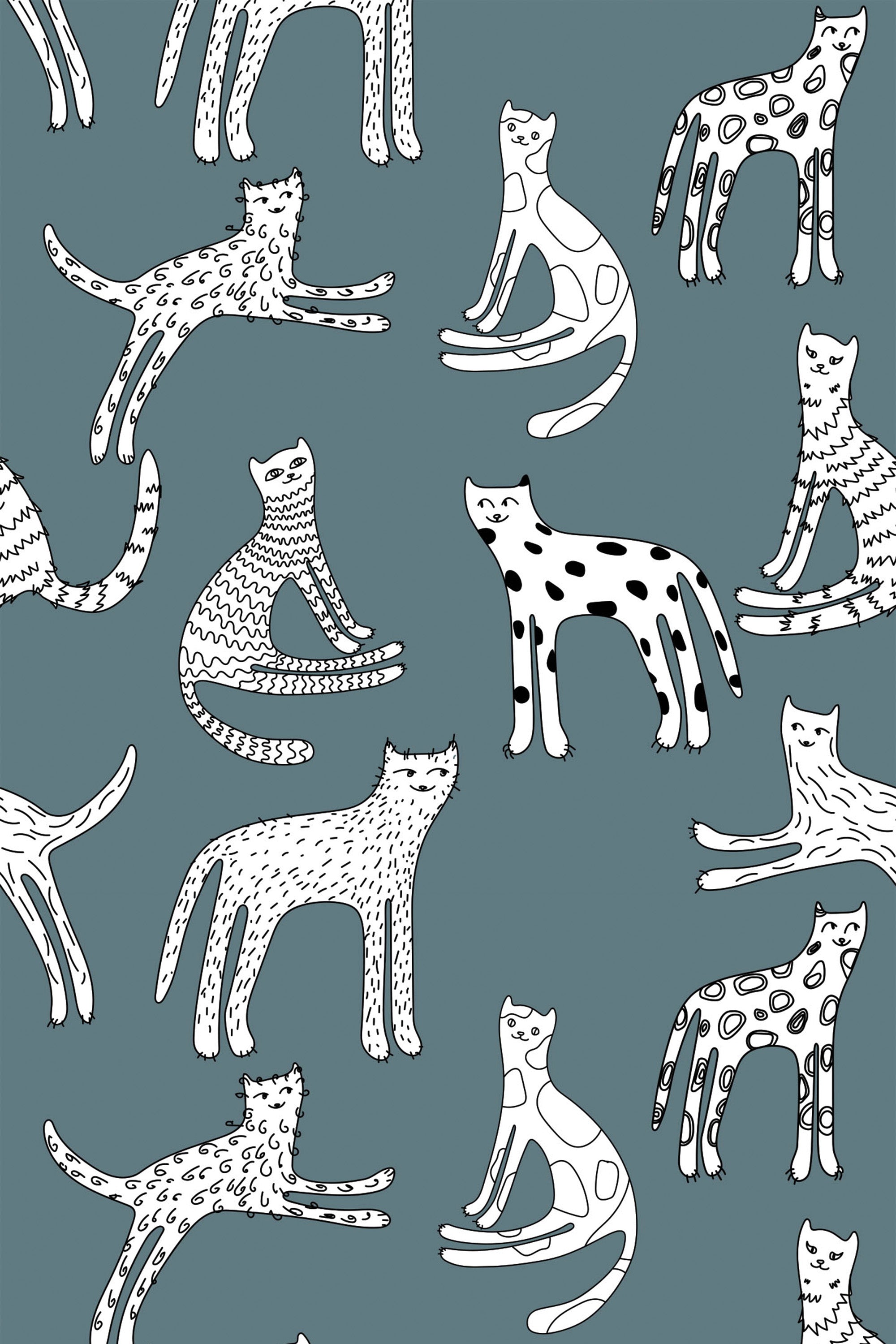 Pattern of playful kittens in various poses on a teal background, peel and stick removable wallpaper.