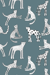 Pattern of playful kittens in various poses on a teal background, peel and stick removable wallpaper.