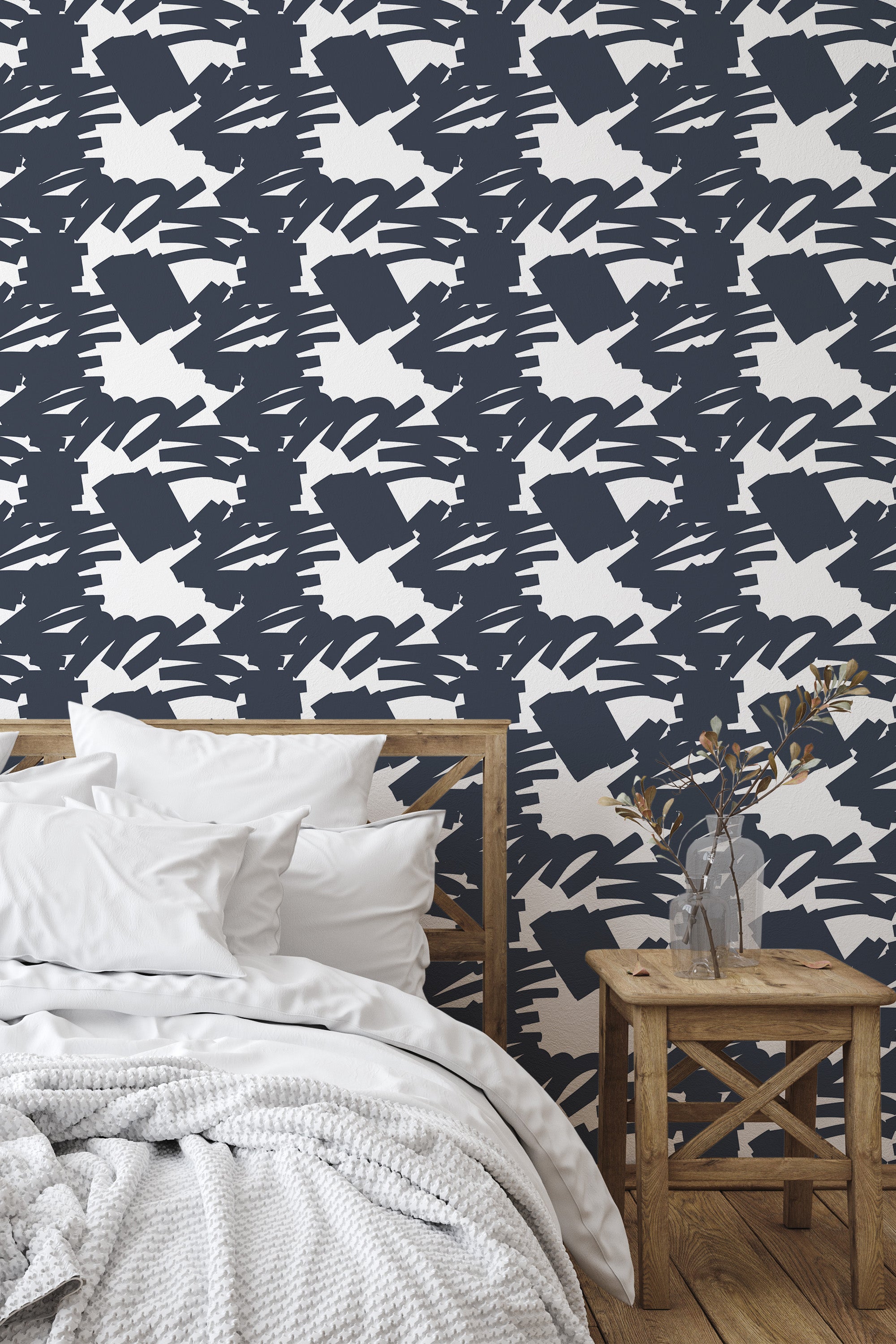 Self-adhesive Bold Navy Stroke wallpaper with abstract white and navy brush strokes on a bedroom wall.