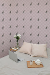 Self-adhesive wallpaper with repeated pattern of stylized Fashion Dog illustrations on a pink checkered background, in a room with a laptop and cushions on a bed.