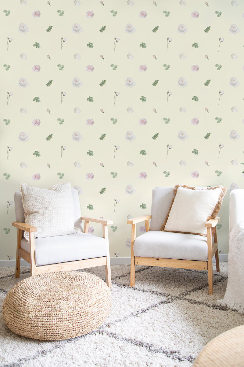 A light-colored wall adorned with soft, delicate watercolor blossoms and sprigs of green leaves in a repeating pattern, offering a serene, nature-inspired look. Traditional wallpaper.