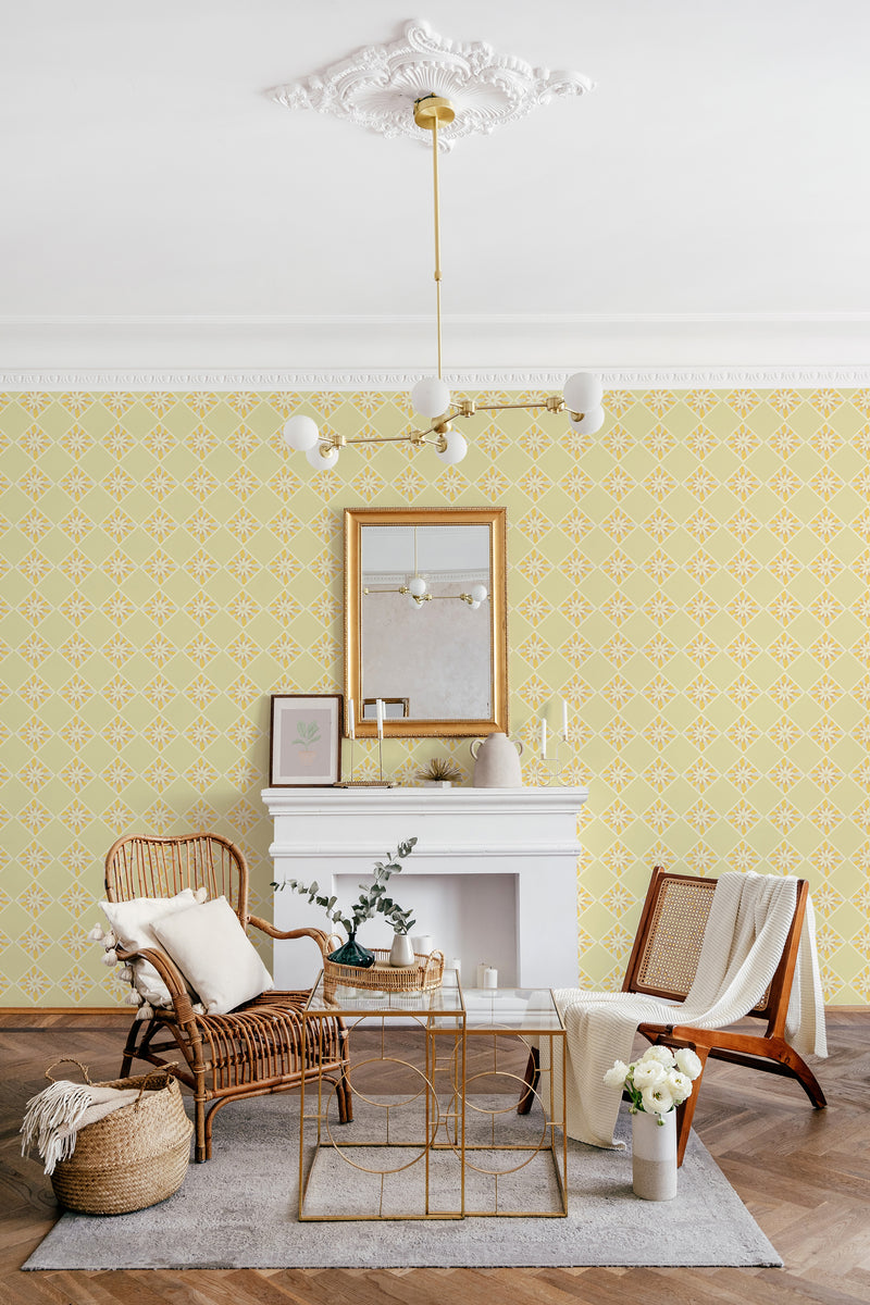 A room with wallpaper that has a repeating yellow and beige geometric sunflower tile pattern. The design complements the traditional decor style of the space, blending seamlessly with the vintage furniture and ornate ceiling molding. Traditional wallpaper.