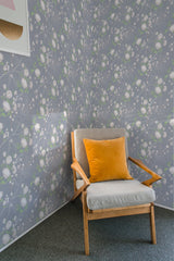 A room with walls covered in grey wallpaper adorned with delicate peony tree patterns, including white and pale green flowers. Traditional wallpaper.