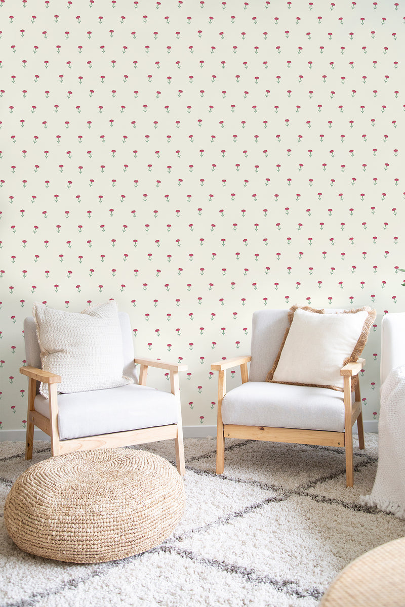 A room with wallpaper decorated with small, scattered vintage roses set against a light cream background, evoking a classic and delicate aesthetic. Traditional wallpaper.