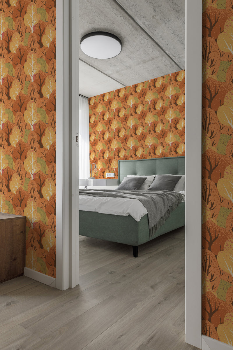 A room with walls covered in Autumn forest-themed traditional wallpaper, showing stylized trees with orange and yellow foliage.