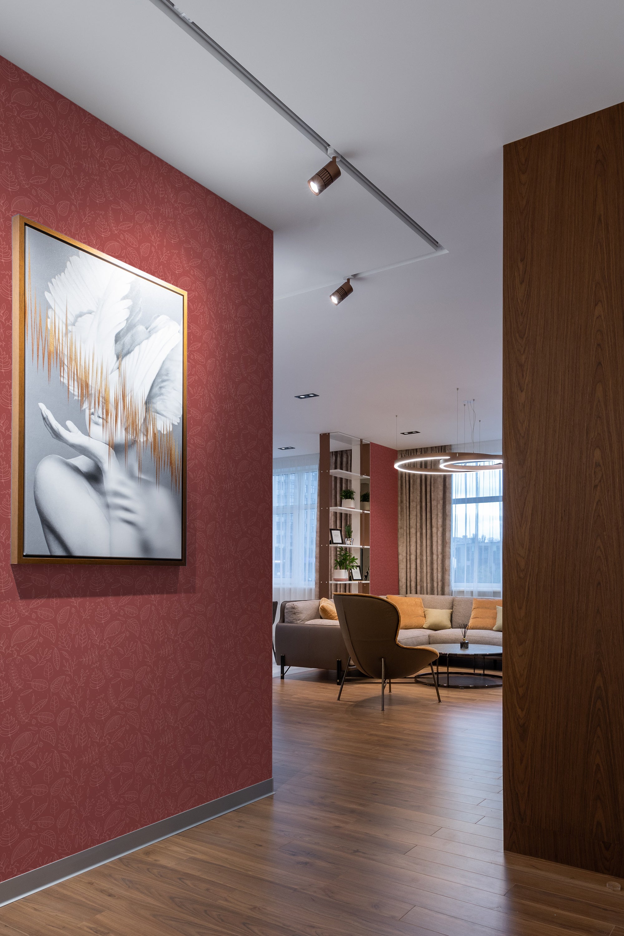 A room with a wall covered in red wallpaper with a subtle, intricate pattern of stylized leaves and vines in a line art style, creating an elegant backdrop that complements the modern decor. Traditional wallpaper.