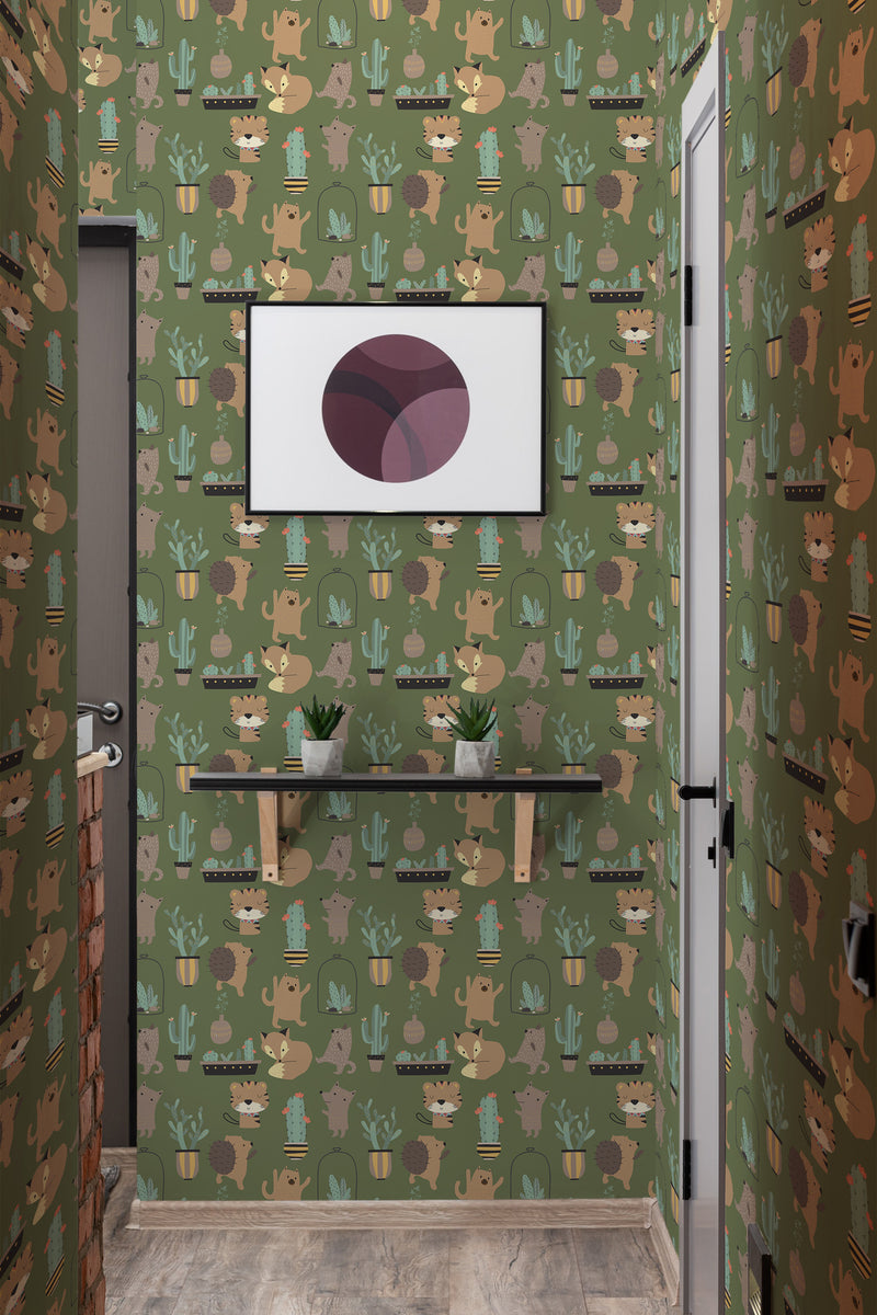 A playful wallpaper pattern with cartoon hedgehogs, trees, mushrooms, and leaves on a green background, creating a whimsical atmosphere in a room with a framed artwork and wooden shelf, titled 'Hedgehog playmates' traditional wallpaper.