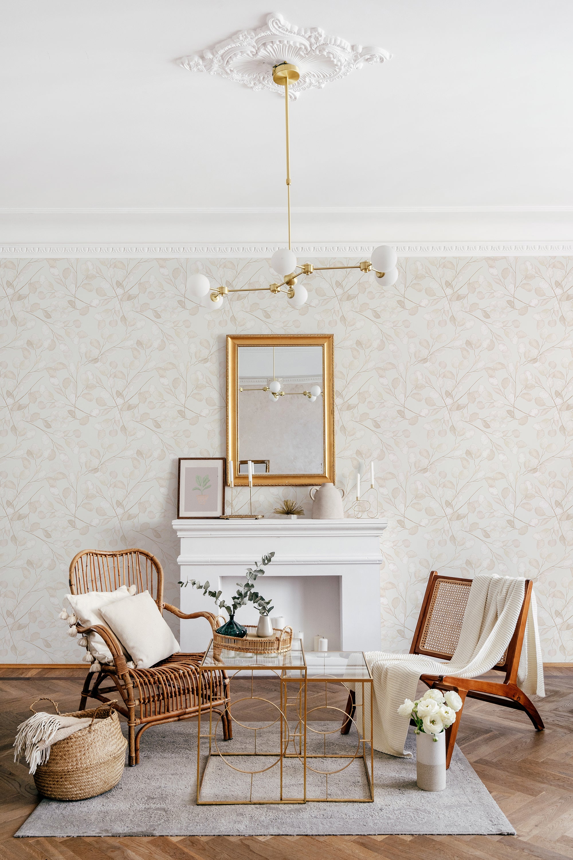 Elegant room with a fireplace and sitting area, walls covered in a subtle beige wallpaper with a pattern of gradient leaves, adding a serene and traditional wallpaper touch.