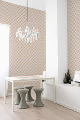 A room with a geometric purple mosaic wallpaper design complemented by a white table, seating stools, and a crystal chandelier, evoking a modern twist on traditional wallpaper.