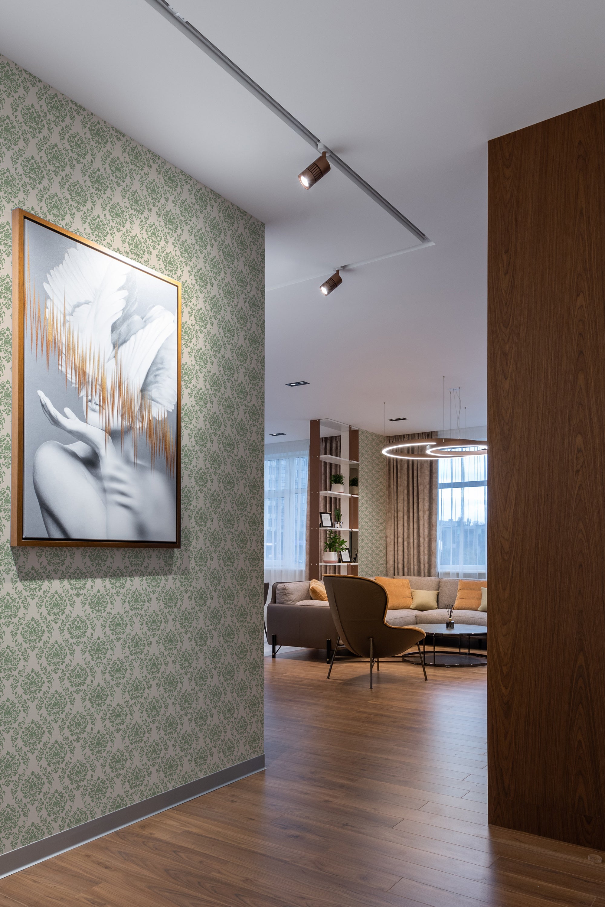 A luxurious room with elegant Green damask wallpaper patterned with intricate traditional designs, complementing the modern decor and wood accents, traditional wallpaper.