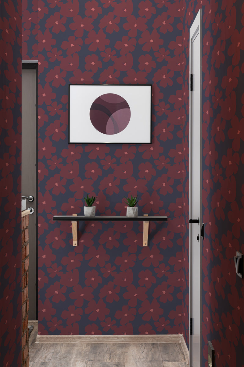 A room with dark-toned wallpaper adorned with red brush stroke flowers, complementing a modern framed artwork and plants on a shelf, creating an elegant ambiance, traditional wallpaper.