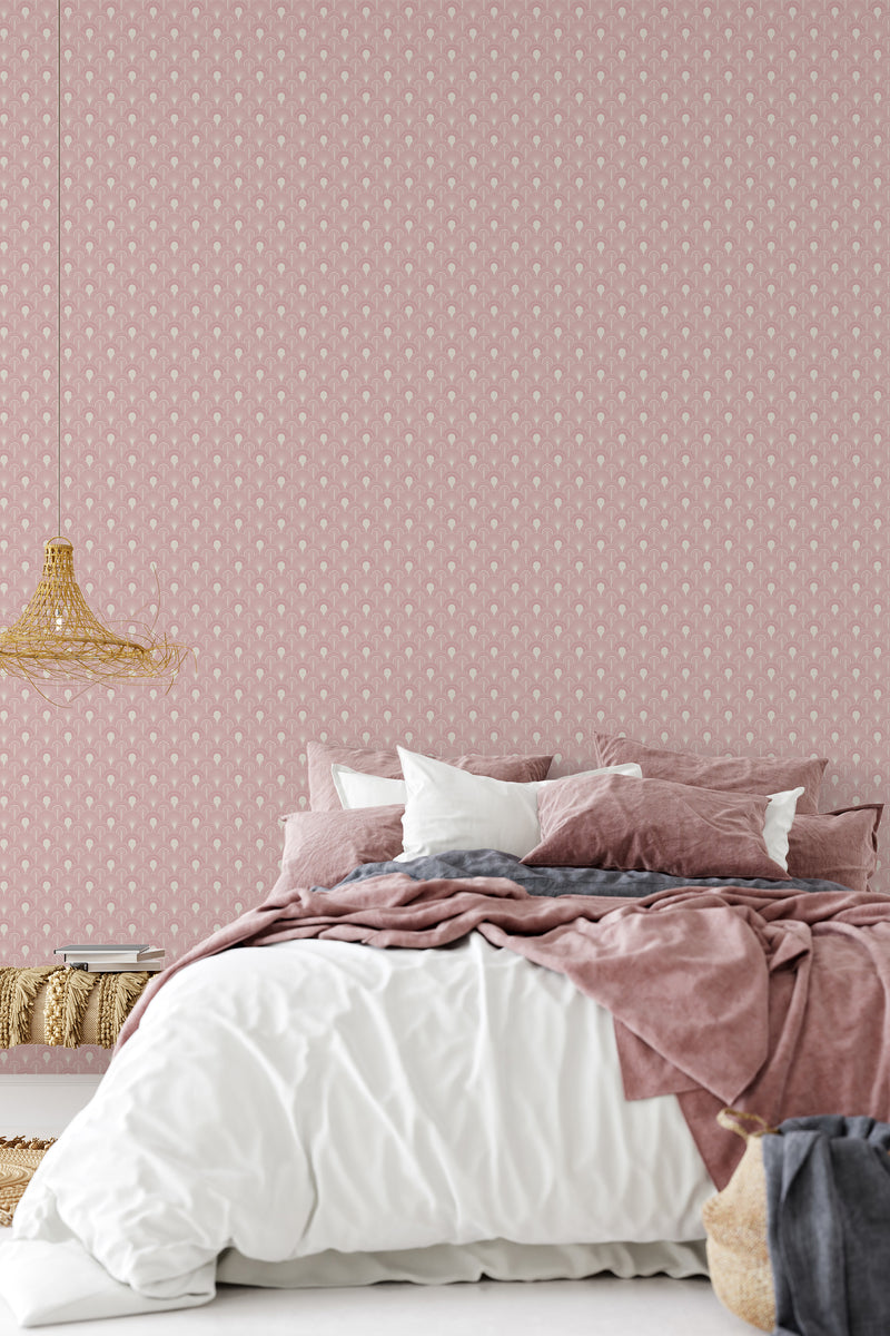 A bedroom with pale pink walls covered in a subtle geometric Art Deco pattern, providing an elegant and traditional wallpaper backdrop.