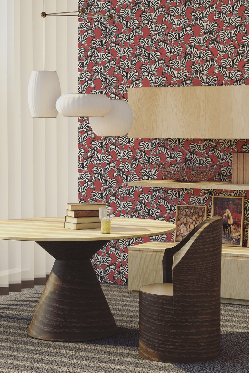 A room with Red Zebra patterned wallpaper with bold red and white stripes and detailed zebra illustrations, complemented by wooden furniture, traditional wallpaper.