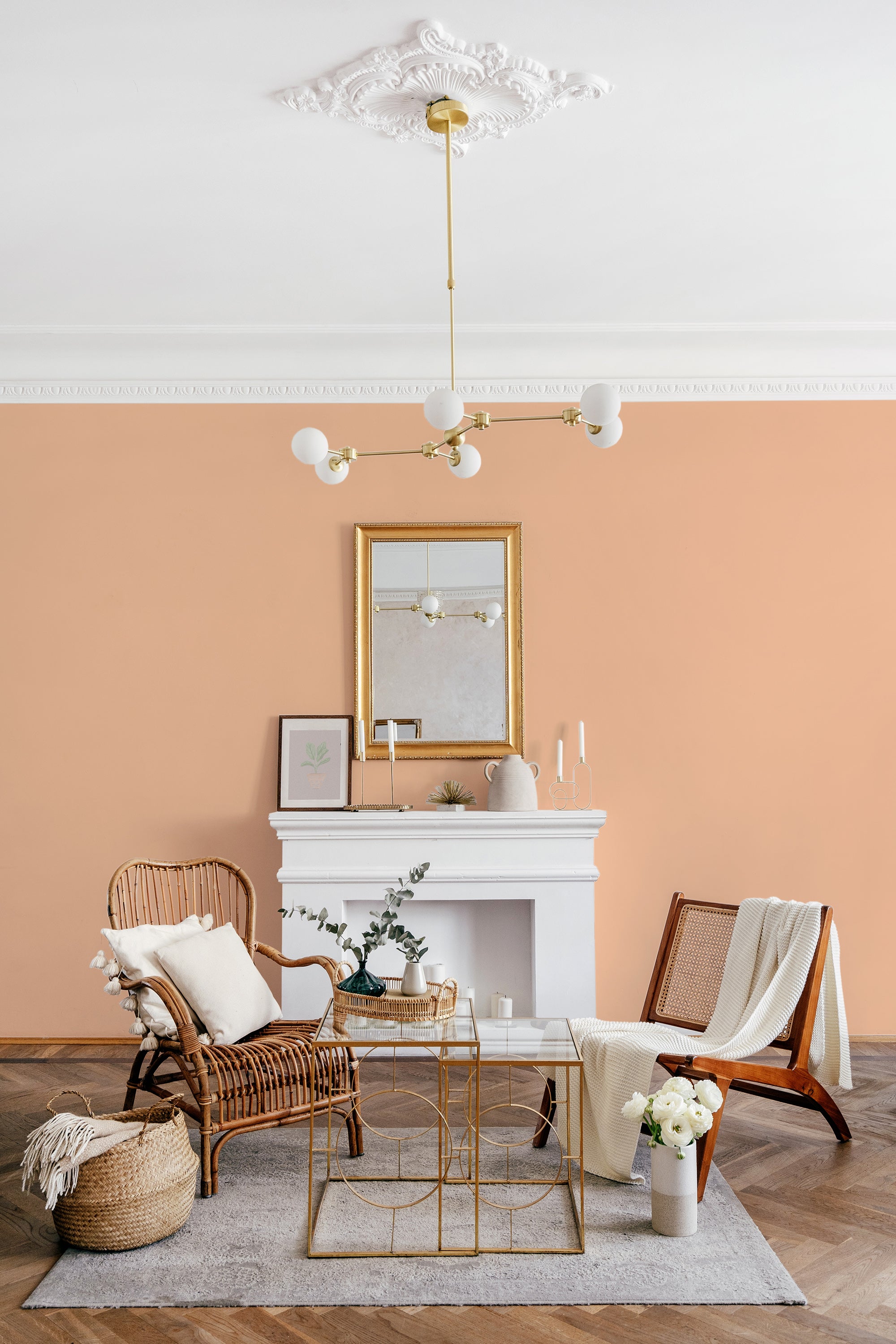 A peach-colored wall with a smooth, uniform appearance serves as a backdrop for a room with elegant decor, concluding with traditional wallpaper.