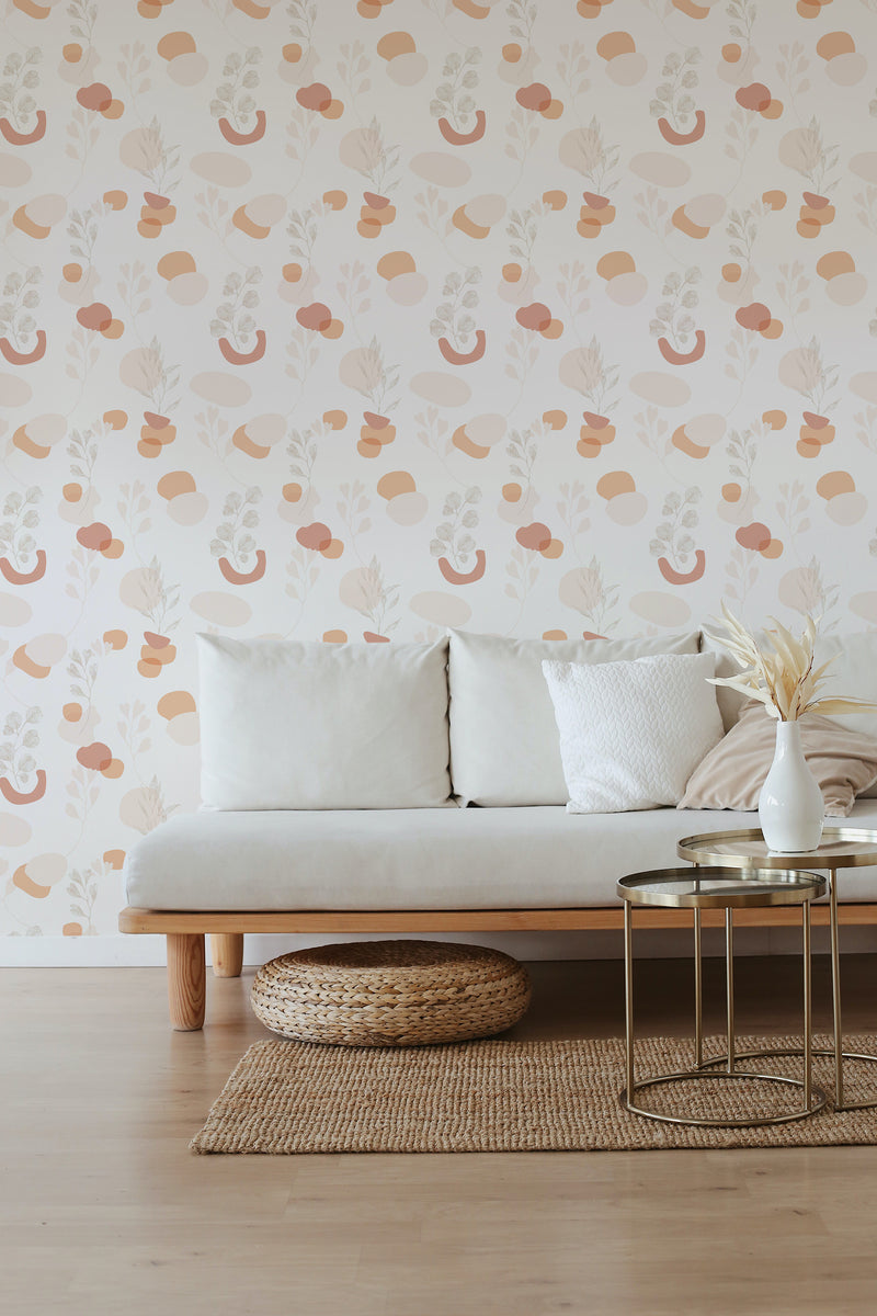 A cozy room with a beige sofa against a wall covered in neutral boho wallpaper with a repeated pattern of terracotta pots and plants on a light background, giving a serene, earthy vibe to the space. Traditional wallpaper.