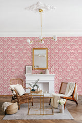 Aesthetic floral linocut design on room wallpaper with repeating patterns in pink and white, complementing a vintage-style interior with traditional wallpaper.