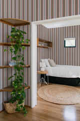 A room with Classic earthy striped wallpaper with alternating shades of brown, beige, and burgundy on the walls, complementing the wooden furnishings, traditional wallpaper.