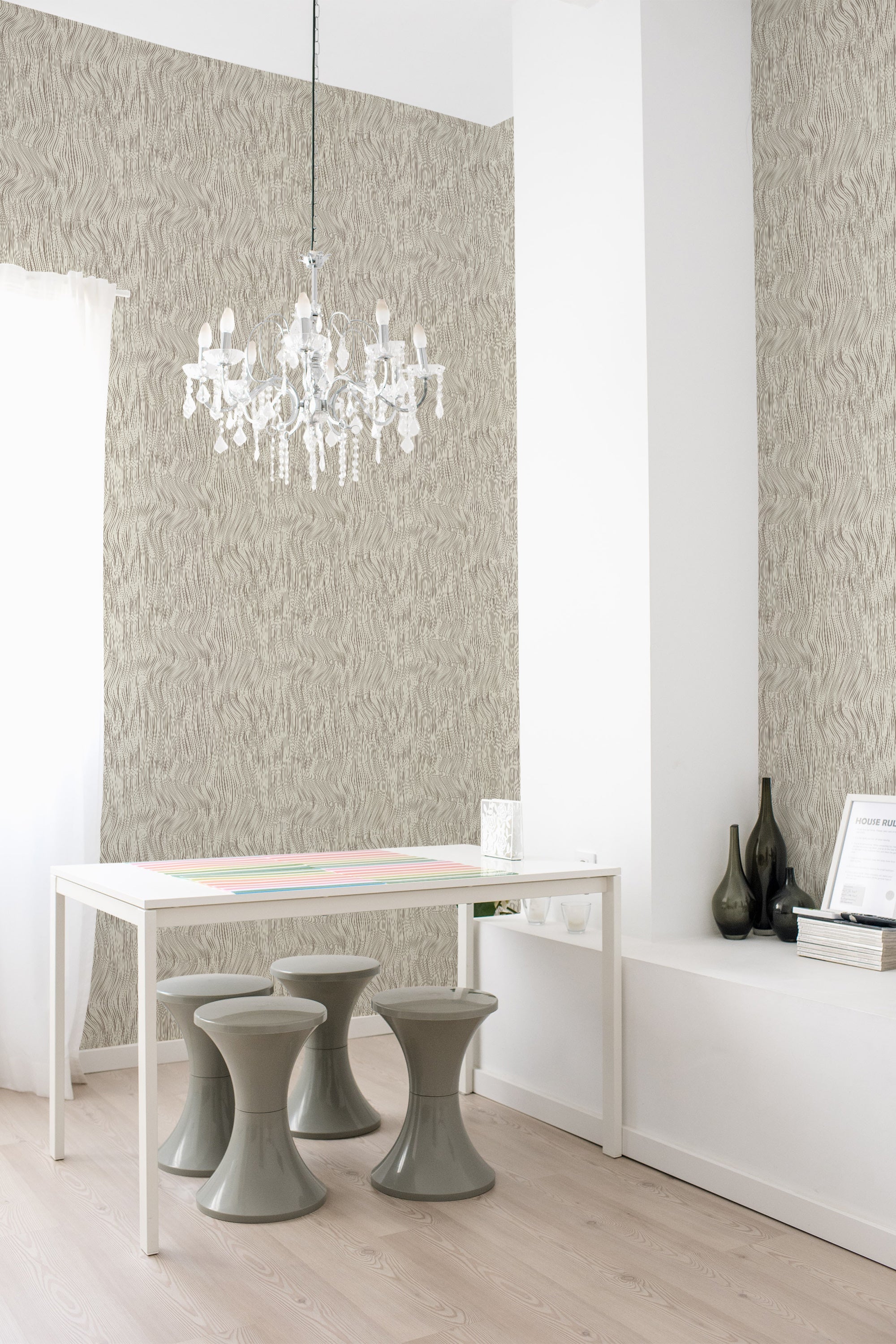 An elegant room with beige, textured seamless optical wallpaper on one wall, accompanied by modern furniture and a crystal chandelier, maintaining a traditional wallpaper aesthetic.