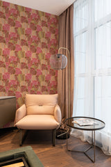 wallpaper stick and peel pink and ocher leaves pattern modern armchair lamp table reading area