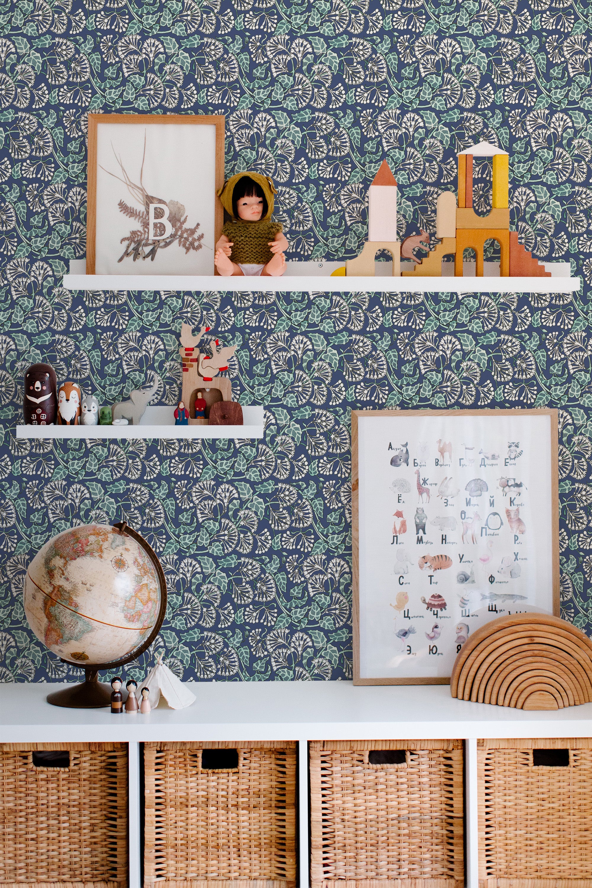 Self-adhesive Art Nouveau inspired wallpaper with intricate leaf patterns and organic shapes in blue and pink tones, complemented by decorative shelves and framed artwork.
