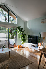 minimalist house terrace green plants living room sage art deco stick and peel wallpaper